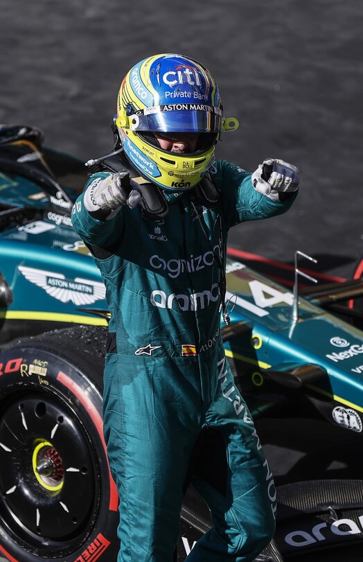 Fernando Alonso in Aston Martin F1 racing suit.